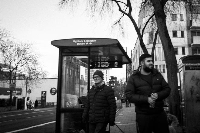 Two men at the bus stop