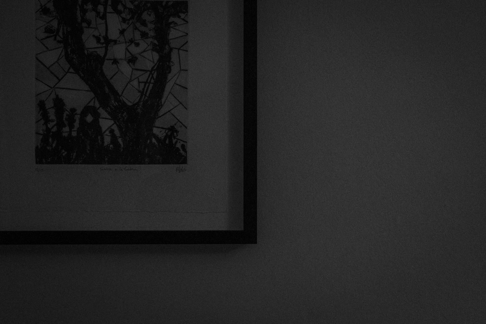 Framed charcoal drawing with tree and person